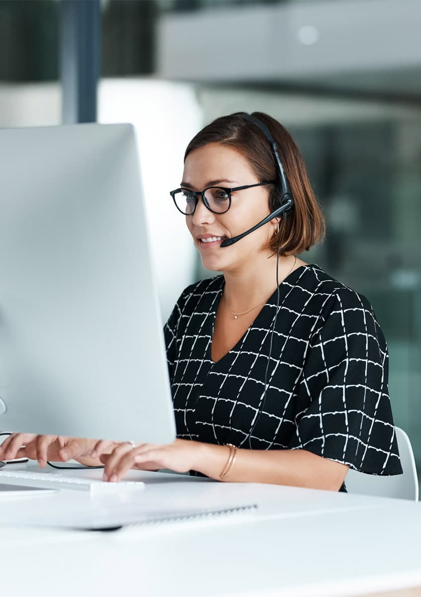 A friendly customer service adviser on a headset