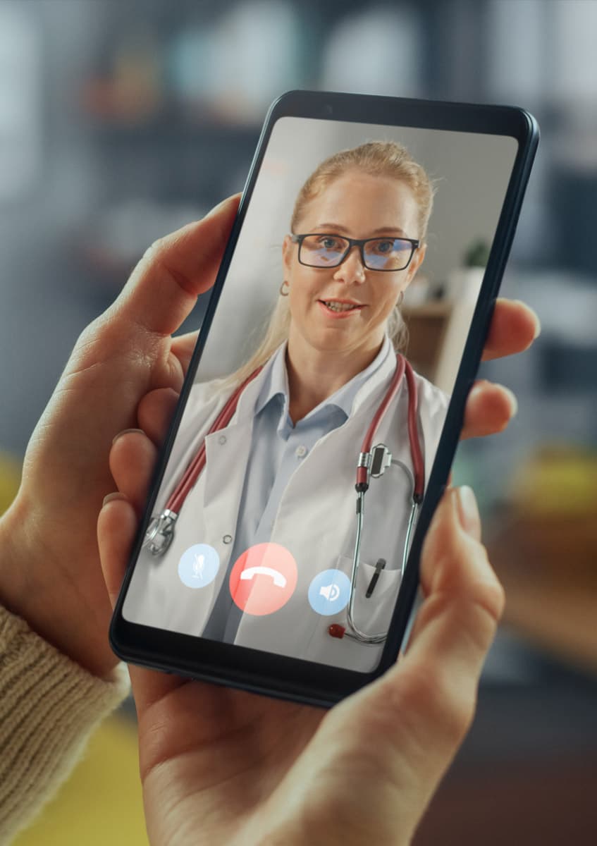 A traveller on a video call with a doctor